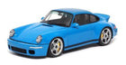 Blue 1:18 scale diecast model sports car with rear spoiler and silver wheels