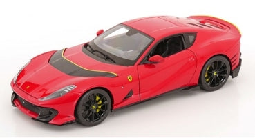 Red 1:18 scale diecast sports car model with black accents and yellow rims