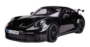 Black 1:18 scale diecast model sports car with rear spoiler, detailed wheels, and sleek design