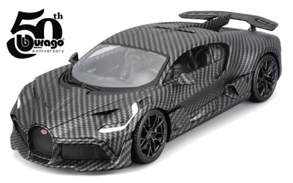 Diecast model car in carbon fiber finish with rear wing, 50th anniversary logo visible.
