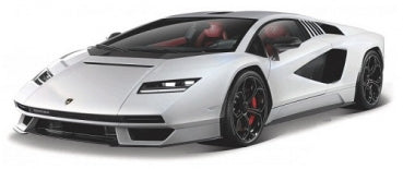 White diecast model sports car with black accents, sleek design, and red interior detailing