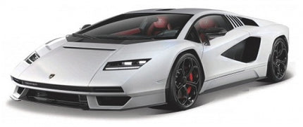 White diecast model sports car in 1:18 scale with black wheels and red interior