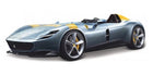 1:18 scale diecast model of a sleek grey open-top sports car with yellow accents.