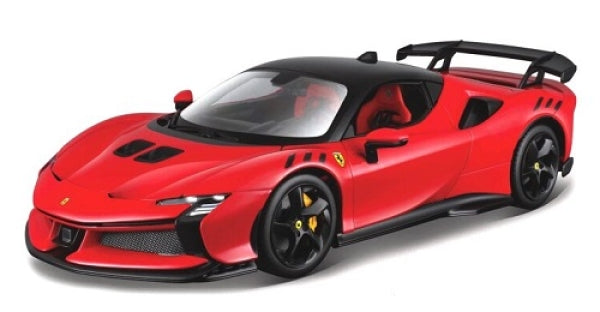 Red diecast Ferrari sports car model with black roof and rear wing on white background