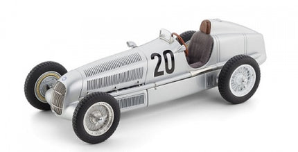 Silver vintage race car diecast model with number 20 on side, 1:18 scale.