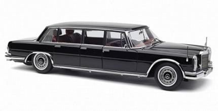 1:18 scale black luxury limousine diecast model car with chrome trim, side view