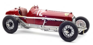 Diecast model of vintage red race car with number 12, 1:18 scale, detailed exterior