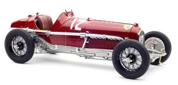 Red vintage diecast model race car with open cockpit, chrome details, and number 12 on side