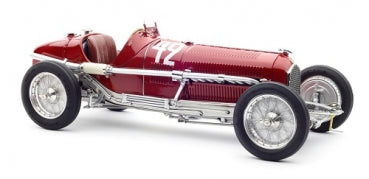 Red vintage race car diecast model with number 42, detailed chrome accents, isolated view