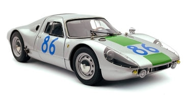 Silver diecast model sports car with green stripe and number 86, 1:18 scale collectible.