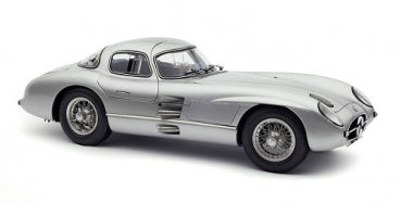 Silver diecast model car 1:18 scale, classic coupe with detailed wheels and sleek body design