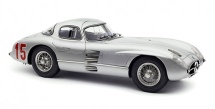 Silver diecast model race car with number 15, detailed wheels, and classic coupe design