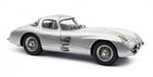 Silver diecast classic model car, coupe body, detailed wheels, 1:18 scale collectible