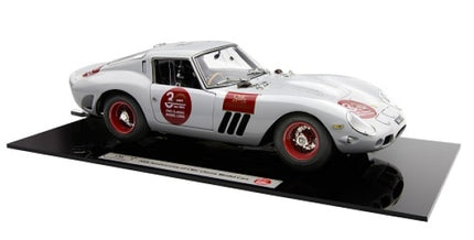 1:18 scale white diecast model car with red wheels and racing decals on display base