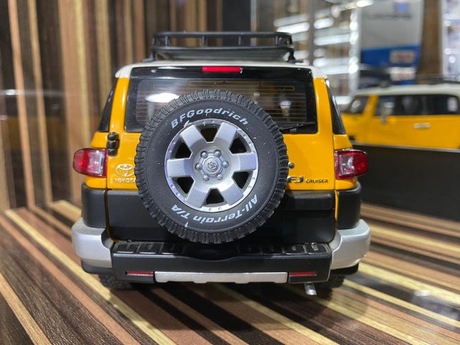 AutoArt Toyota FJ Cruiser Yellow 1:18 Diecast Model Car - studio product photo of the scale model