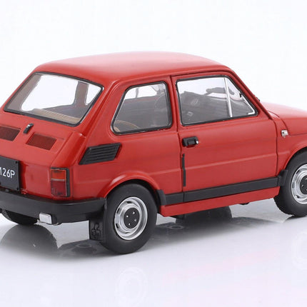Rear-left angled view of a 1:24 scale Fiat 126p diecast model car in bright red, showcasing the boxy two-door hatchback rear with vertical vents on the C-pillar, rear engine cover, rectangular taillights, black bumper and silver hubcap wheels against a white background.