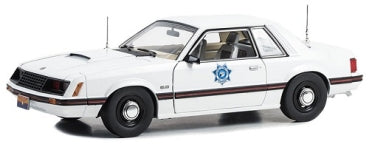 1:18 scale diecast white police car model with side emblem and black stripe detailing