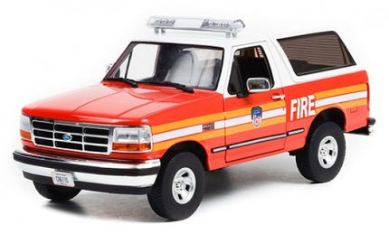 1:18 scale diecast model red Ford fire department SUV with emergency lights and detailed decals