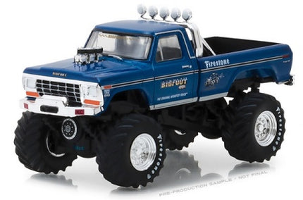 Blue diecast model monster truck with large tires and chrome engine details