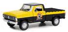 Yellow and black diecast pickup truck model with Armor All logo, 1:18 scale collectible.