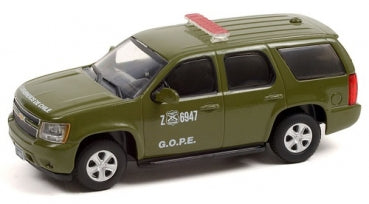 Green diecast model SUV police car with roof siren and G.O.P.E. markings, 1:43 scale