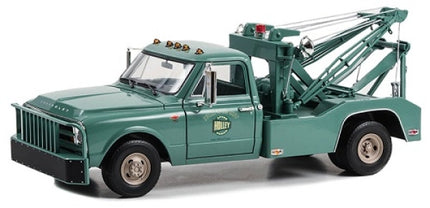 Green diecast model tow truck, 1:18 scale, detailed vintage design