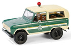 1:18 scale diecast model of vintage green and cream police SUV with red siren and detailed interior