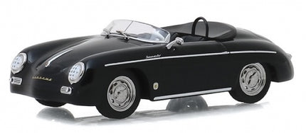 1:18 scale black diecast Porsche convertible model car with chrome details on white background