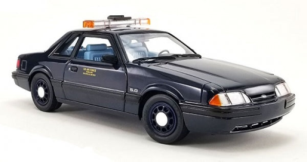 1:18 scale diecast black police car model with light bar, detailed interior, and classic design