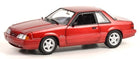Red 1:18 scale diecast model car coupe with detailed wheels and black trim