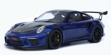 1:18 scale blue diecast model sports car with black hood, rear spoiler, and detailed rims