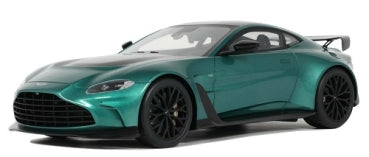 Green diecast model sports car coupe with black wheels and rear spoiler, 1:18 scale