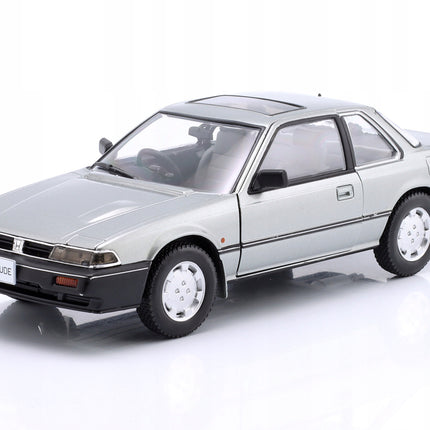 https://a.allegroimg.com/original/111455/2c8b1ad8409087619d076c3f41cb/Honda-Prelude-1985-Grey-Metallic-WhiteBox-1-24-Metalowy-Model-Samochodu