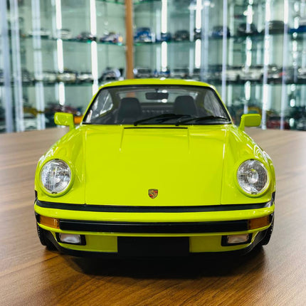 Minichamps Porsche 911 Turbo (1977) 1/12 Diecast Model Light Green - studio product photo of the scale model