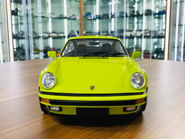 Minichamps Porsche 911 Turbo (1977) 1/12 Diecast Model Light Green - studio product photo of the scale model