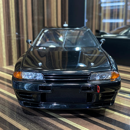 AutoArt Nissan Skyline GT-R R32 Black 1:18 Diecast Model Car - studio product photo of the scale model