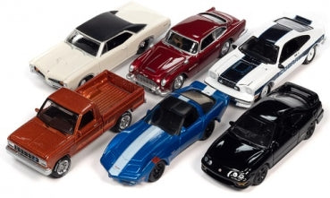 Six diecast model cars in assorted styles and colors, including a pickup truck and sports cars, displayed together.