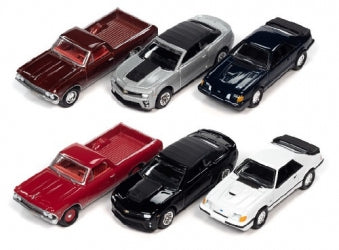 Assorted 1:24 scale diecast model cars including pickup trucks and sports cars, various colors.