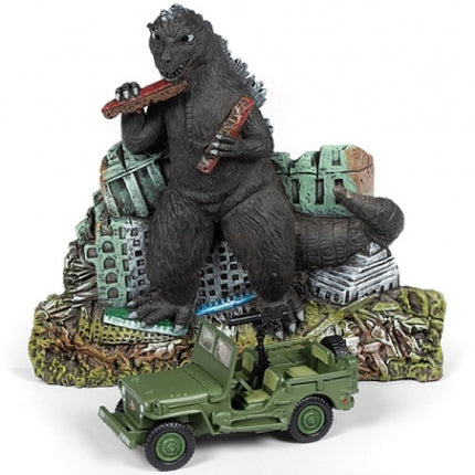 Diecast military jeep model with Godzilla figurine and ruined city backdrop, collectible display