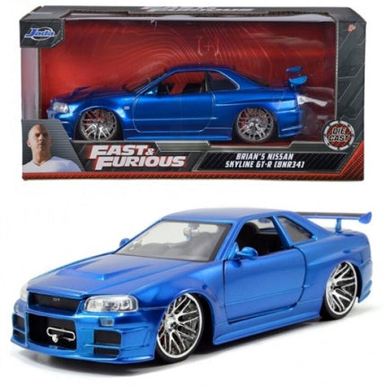 Blue Nissan Skyline GT-R R34 diecast model car from Fast and Furious, with display box.