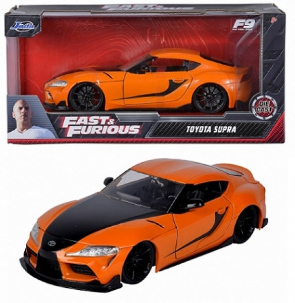 Orange and black Fast & Furious Toyota Supra diecast model car in 1:24 scale with packaging.