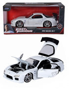 1:24 scale diecast 1993 Mazda RX-7 model car, white, with Fast & Furious packaging, open hood and doors