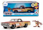 Diecast 1967 Chevrolet El Camino model car with Looney Tunes Tasmanian Devil graphics and figure.