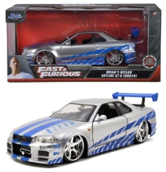 1:24 scale diecast Nissan Skyline GT-R R34 silver and blue model car with box