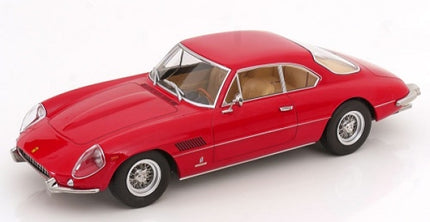 Red 1:18 scale diecast classic sports car model with tan interior on white background
