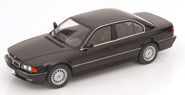 1:18 scale black diecast BMW sedan model car with silver wheels, displayed on white background