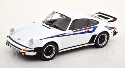 White diecast Porsche model car 1:18 scale with racing stripes and black wheels