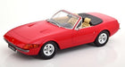 Red 1:18 scale diecast convertible model car with tan interior on white background