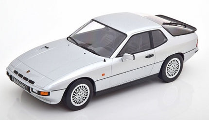 1:18 scale diecast model of a classic silver Porsche sports car on white background