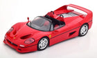 Red diecast model sports car, 1:18 scale, convertible with detailed wheels and interior